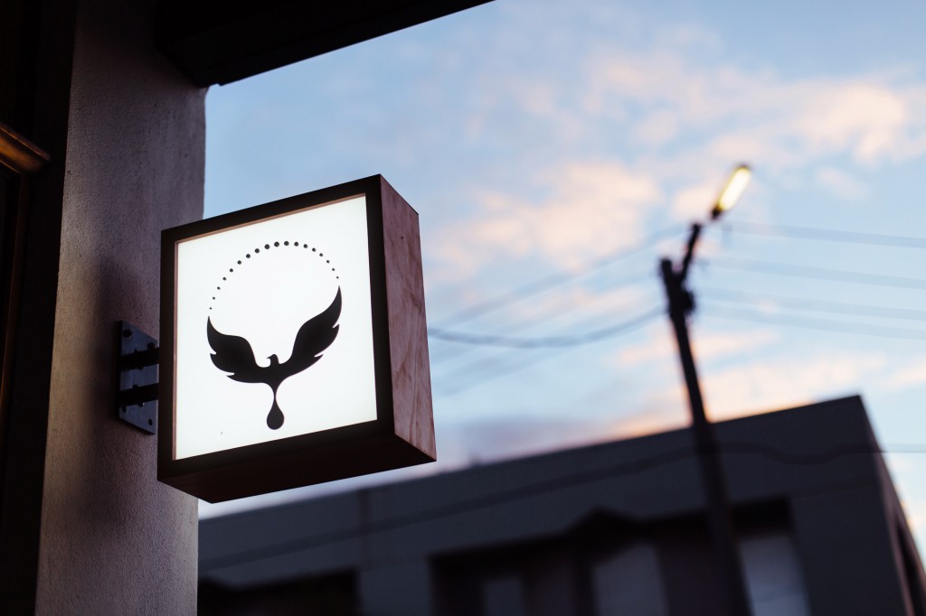 omar coffee bird sign logo